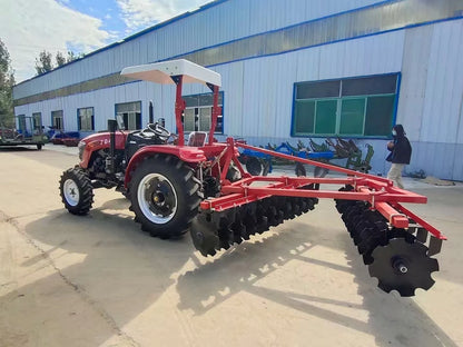 The Tractor Equipped with the Disc Plow Is Used for Plowing the Fields, Agricultural Tillage, Land Loosening, and Land Clearing