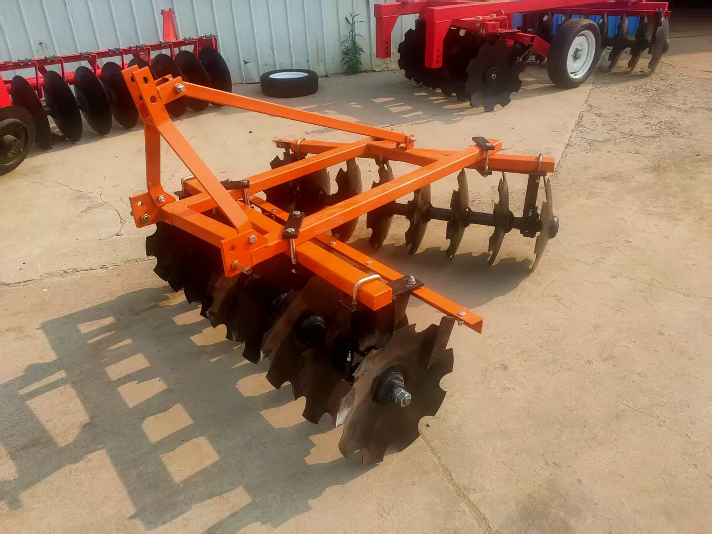 The Tractor Equipped with the Disc Plow Is Used for Plowing the Fields, Agricultural Tillage, Land Loosening, and Land Clearing